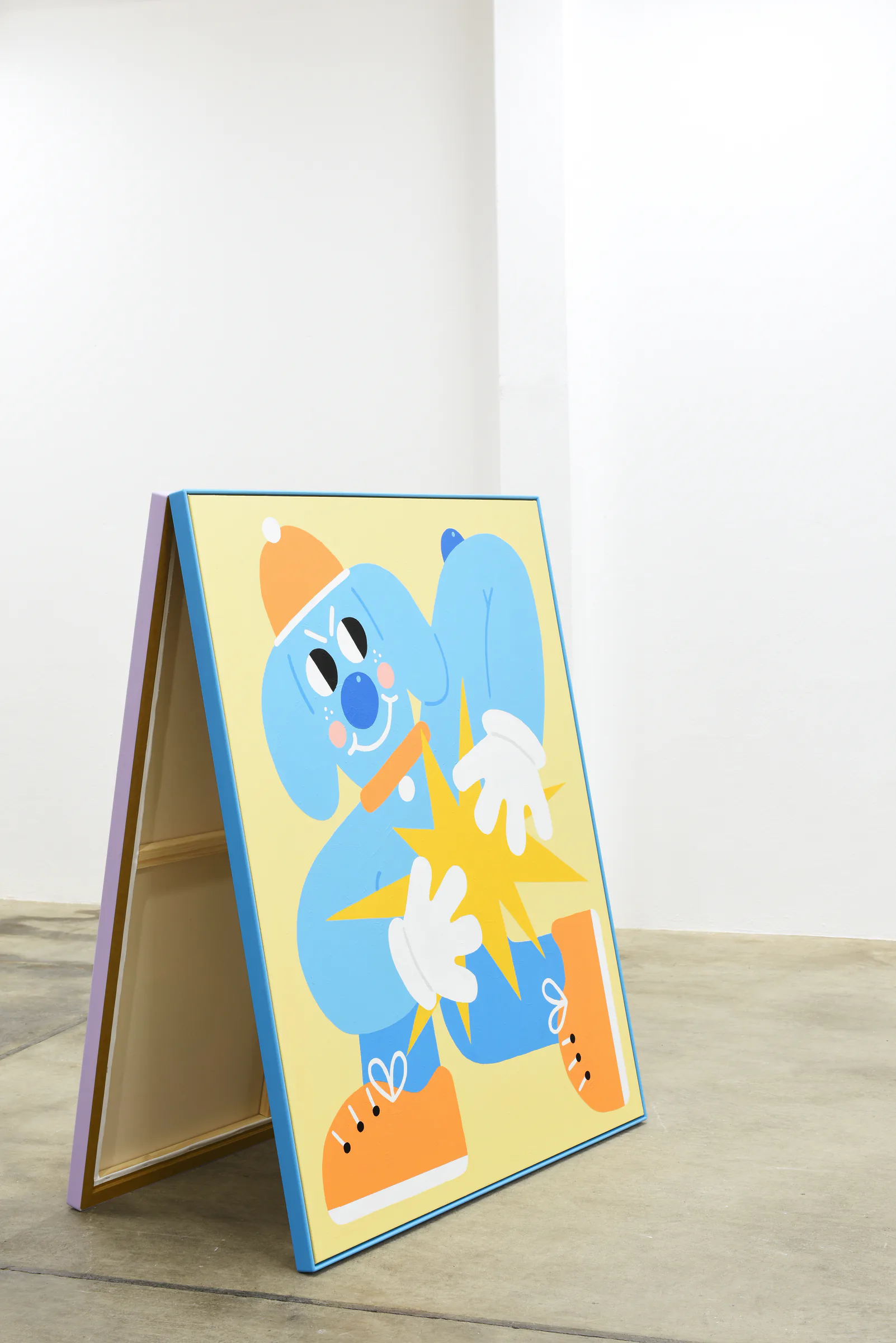 Angled view of the blue Sports Dreams painting on its freestanding A-frame
