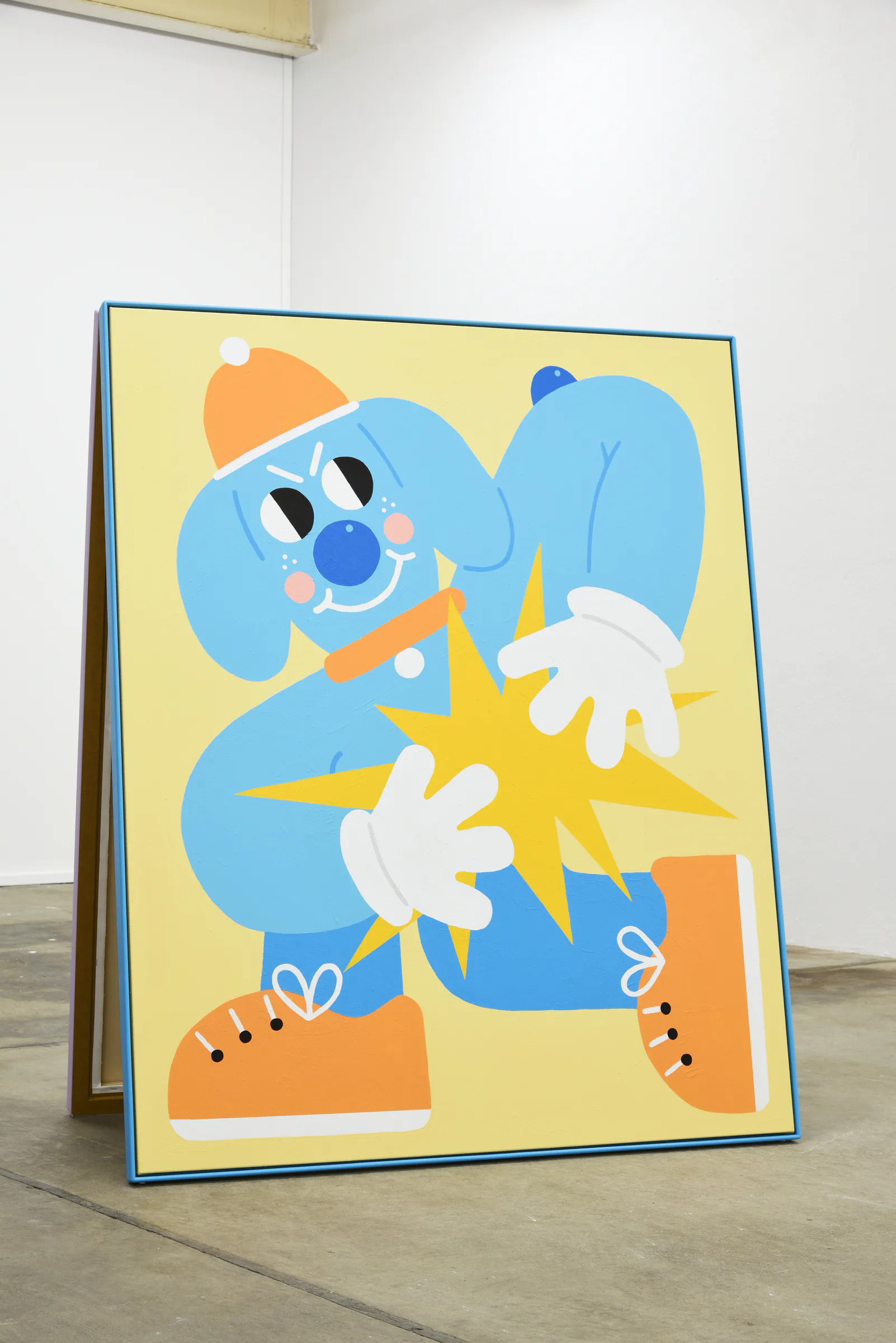 Blue character painting on a freestanding frame at Sports Dreams
