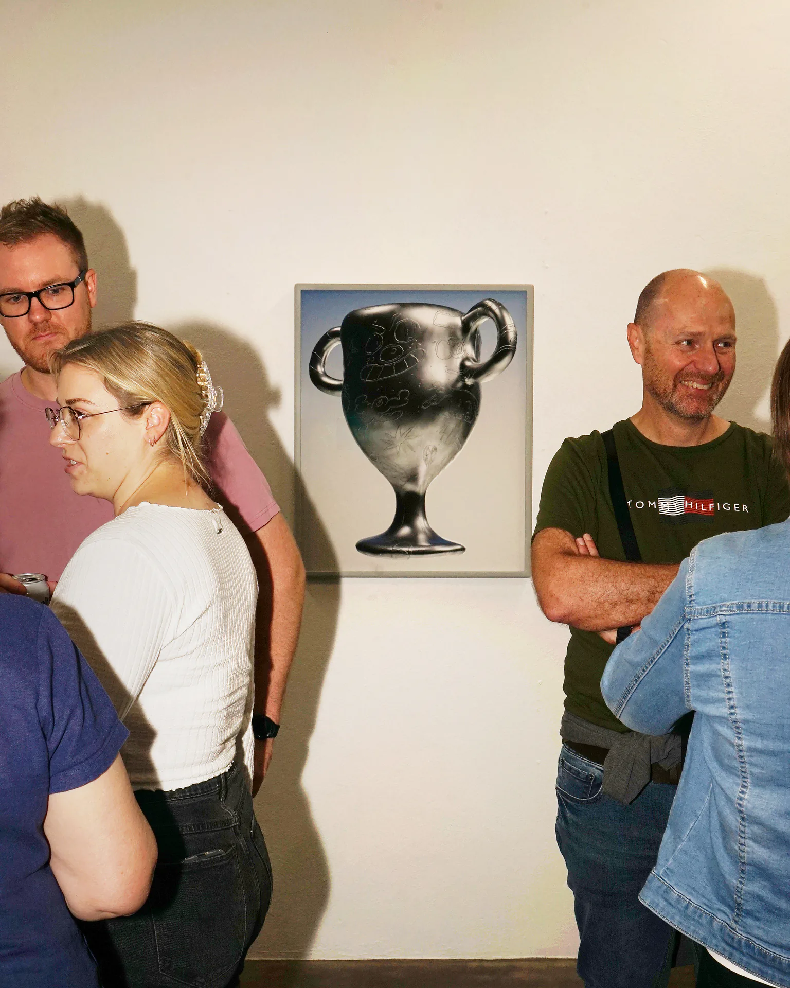 Visitors viewing the trophy artwork at the Sports Dreams exhibition opening
