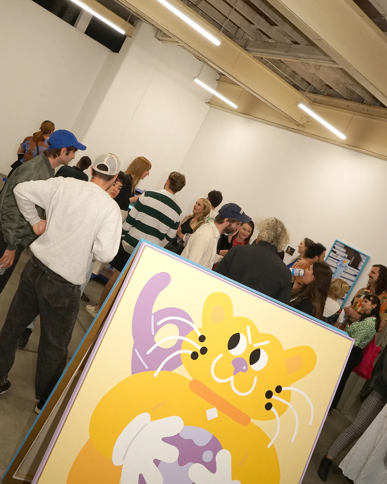 Yellow character painting in the foreground of the Sports Dreams opening